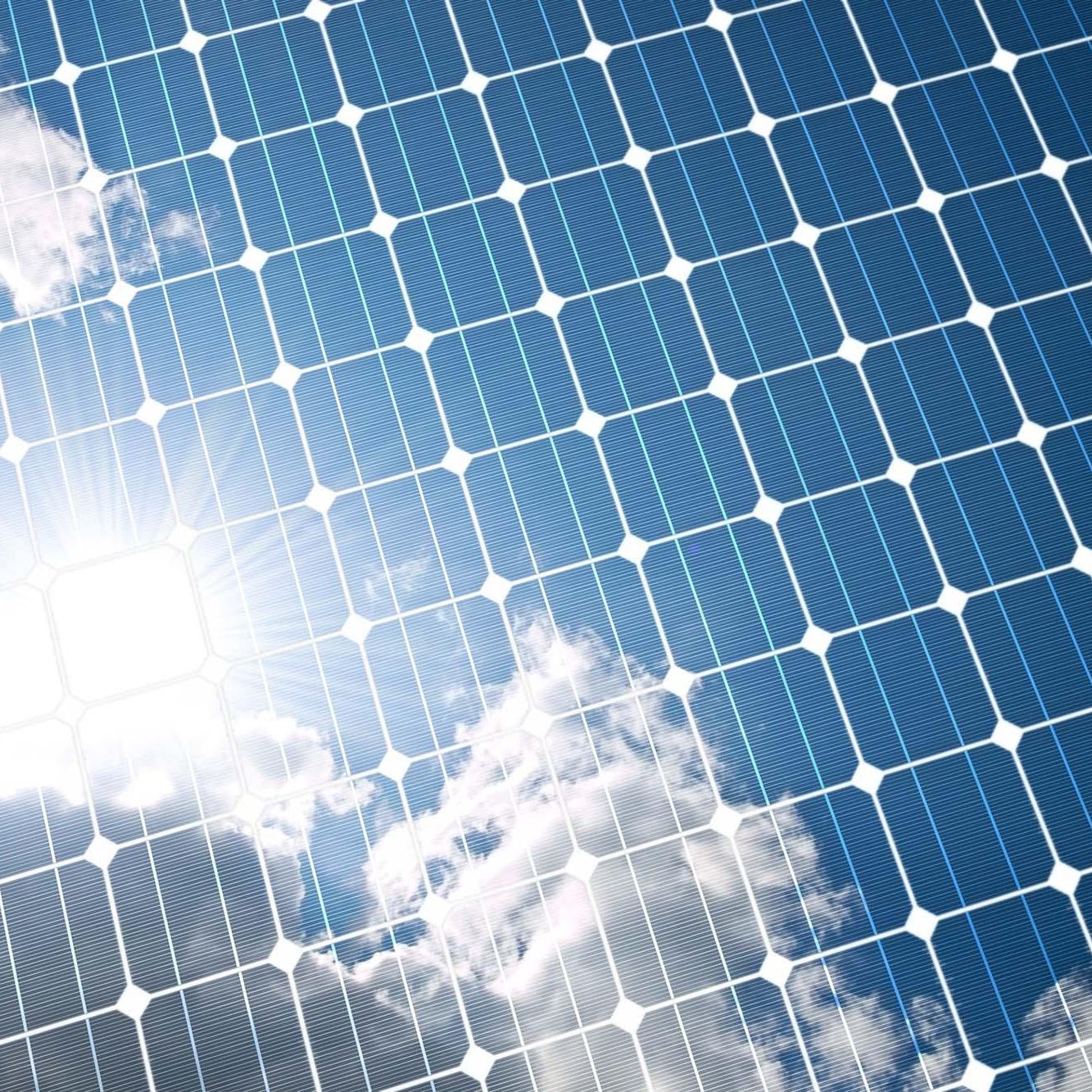 The sunny sky is reflected, in the solar panel.